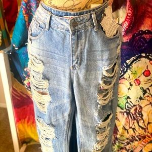Ripped boyfriend jeans. Never worn. Tags.